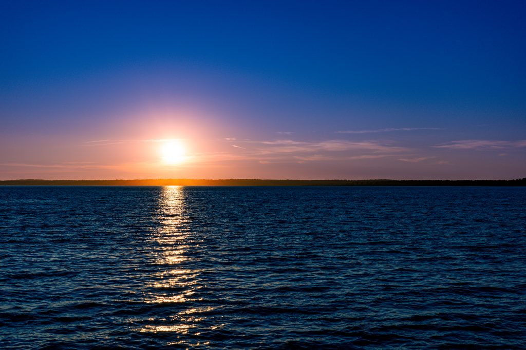 Severed_v1.zip 20 Sun setting over calm blue water, a quiet moment of letting go