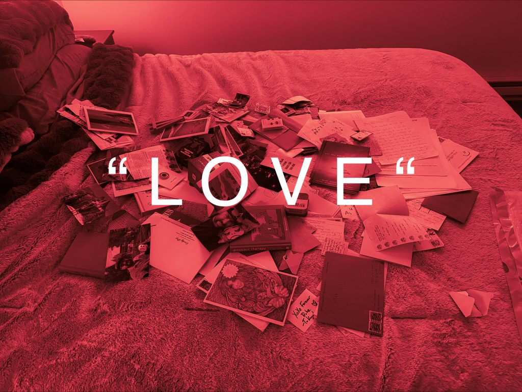 Off_The_Radar_MP4.zip 4 Pile of old cards and letters on a red-lit bed with the word LOVE over it