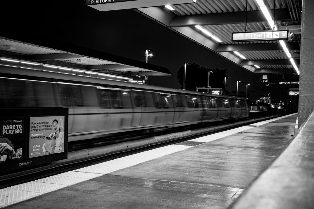 Severed_v1.zip 8 Black and white train speeding past an empty station platform