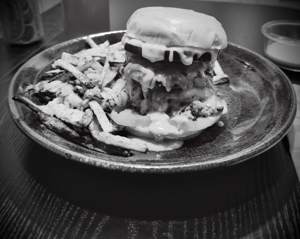 Living_On_Purpose_v1.zip 3 Black and white photo of a burger and fries on a plate